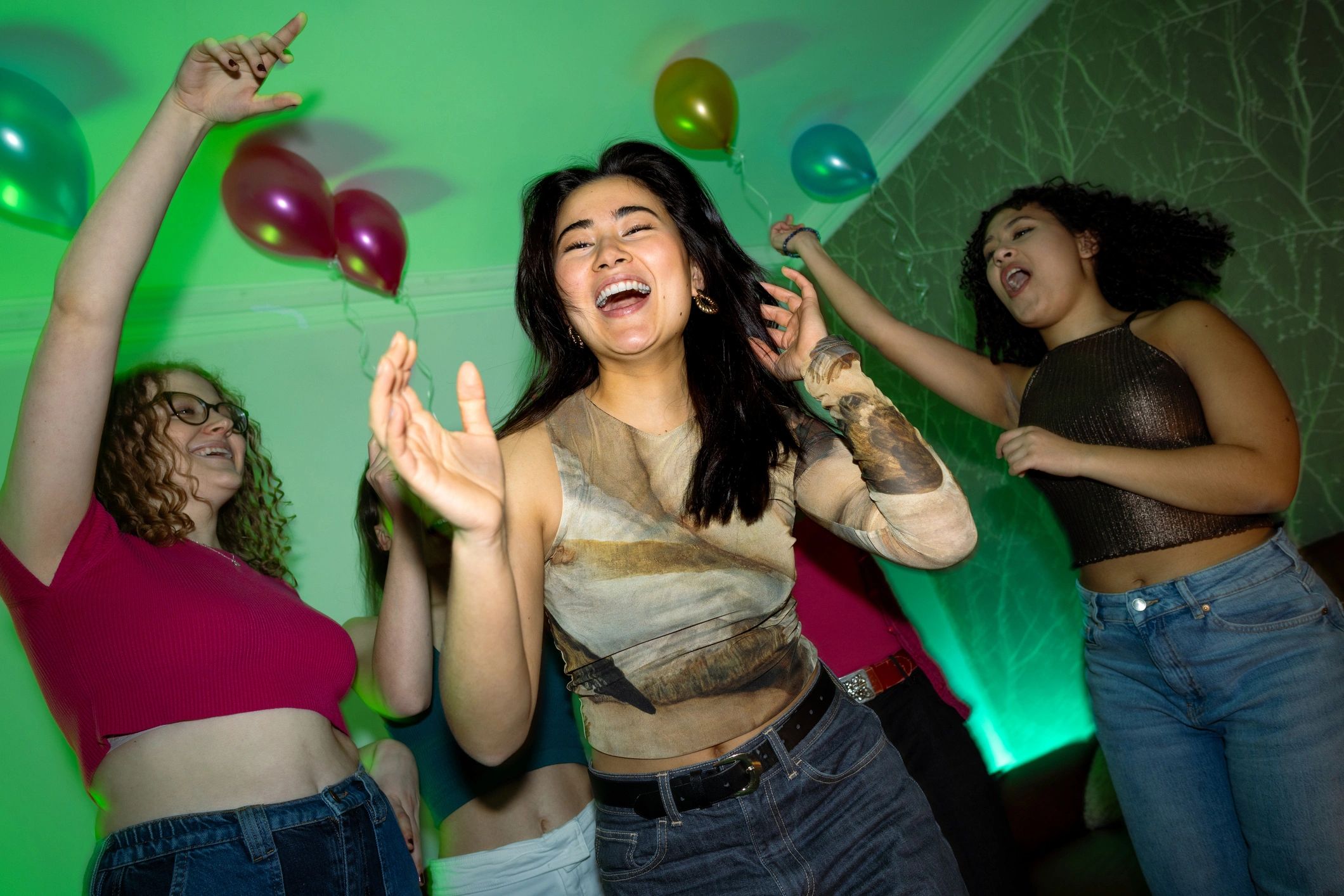 Friends dancing together at a party