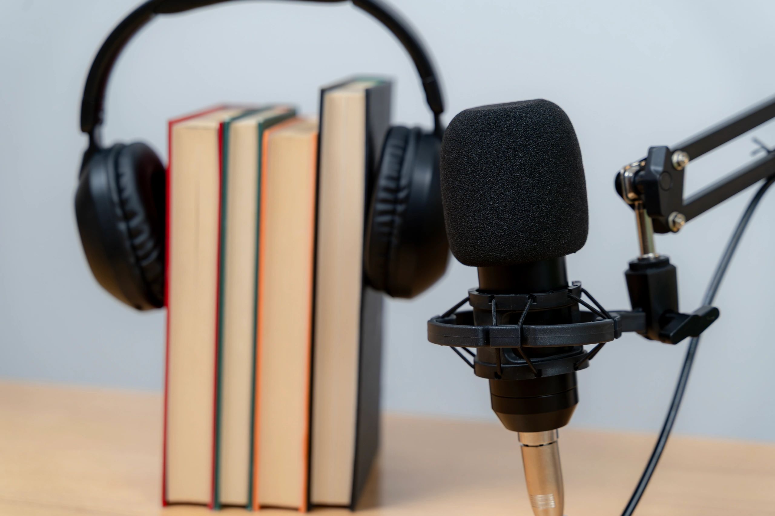 Podcast microphone and recording equipment on a studio table